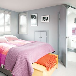 bedroom with grey wall and white window