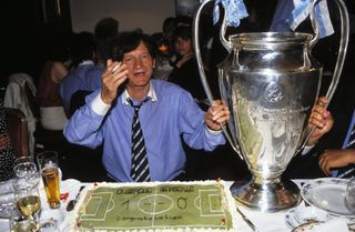 Marseille coach Raymond Goethals celebrates with the European Cup after the club's win over AC Milan in the Champions League final in May 1993.