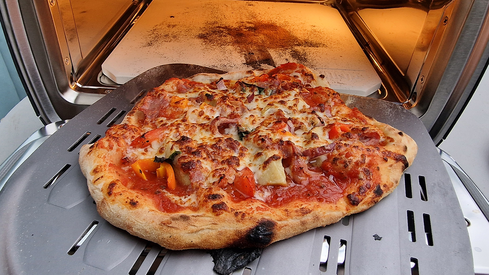 Tomato burrata pizza made in the Ninja Artisan pizza oven