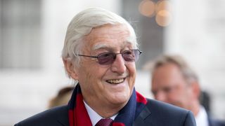 Michael Parkinson arrives at a 2013 memorial service for the South African born, former England cricket captain Tony Greig