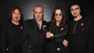 Black Sabbath’s reunited original line-up posing for a photograph in 2011