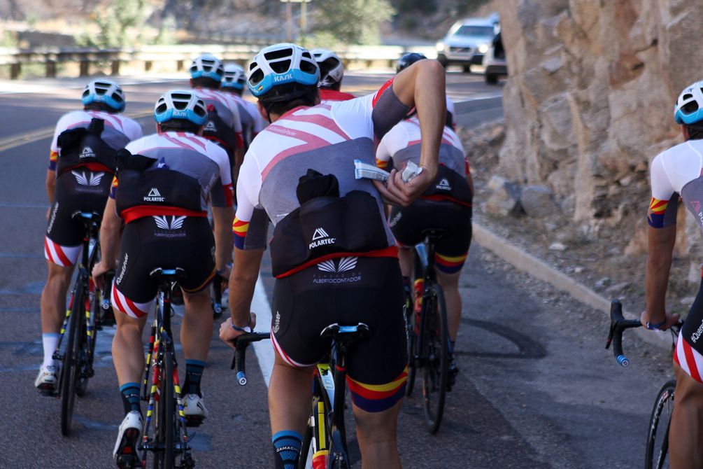 A rider reaches for fuel mid-ride.