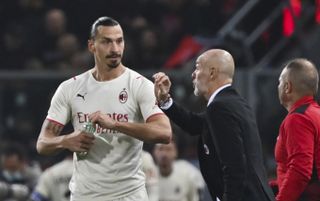 AC Milan’s Stefano Pioli gives instructions to Zlatan Ibrahimovic