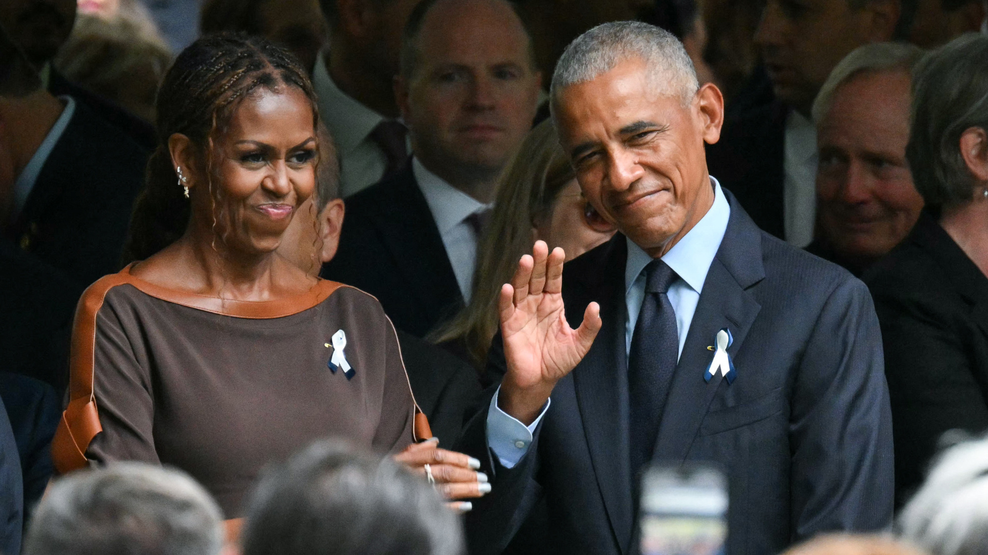 Former US President Barack Obama and former First Lady Michelle Obama attend the 25th anniversary commemoration of the September 11, 2001 attacks at the National September 11 Memorial in New York 