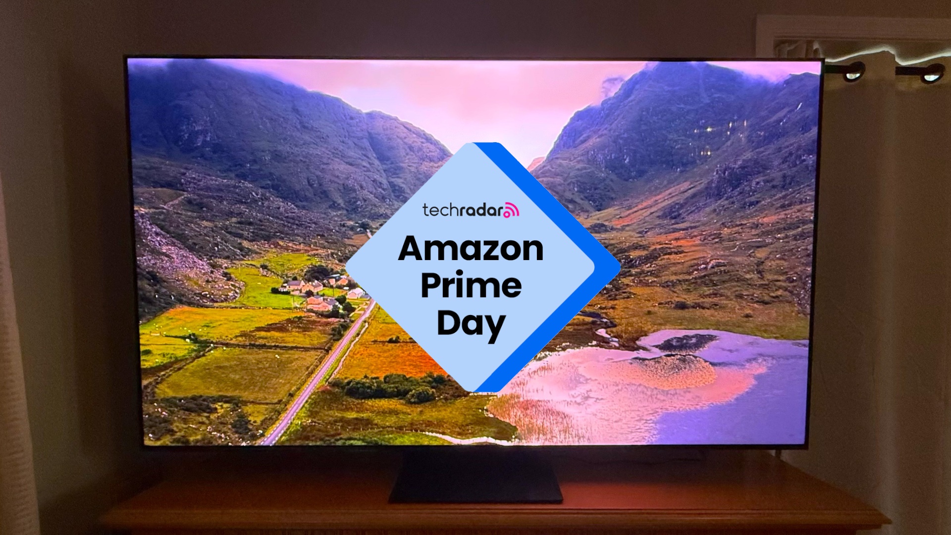 The TCL QM7L with a landscape image on its screen overlaid with a badge reading Amazon Prime Day.
