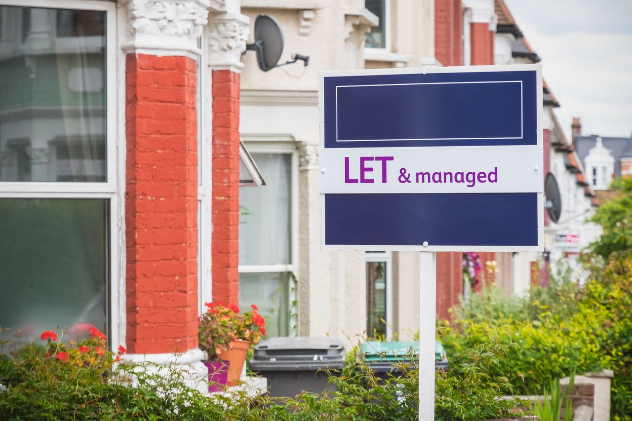 Let and managed sign displayed outside a terraced house