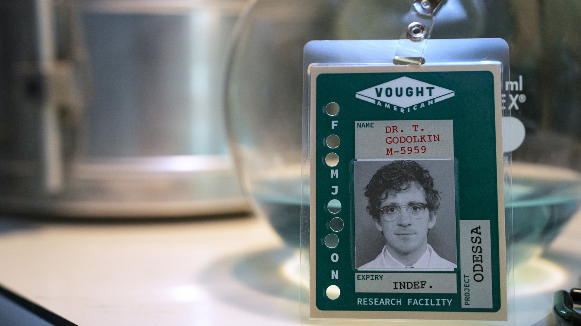 A screenshot of Doctor Thomas Godolkin&#039;s nametag badge propped up on a table in Gen V season 2