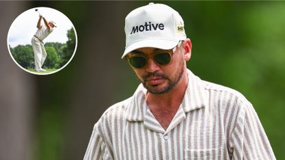 Jason Day walks on to the green whilst wearing sunglasses