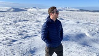 best synthetic puffer jackets: Haglöfs Särna Jacket in snowy hills