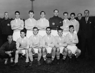 Manchester City's team in November 1954, featuring assistant trainer and former striker Fred Tilson, second from right in the back row.