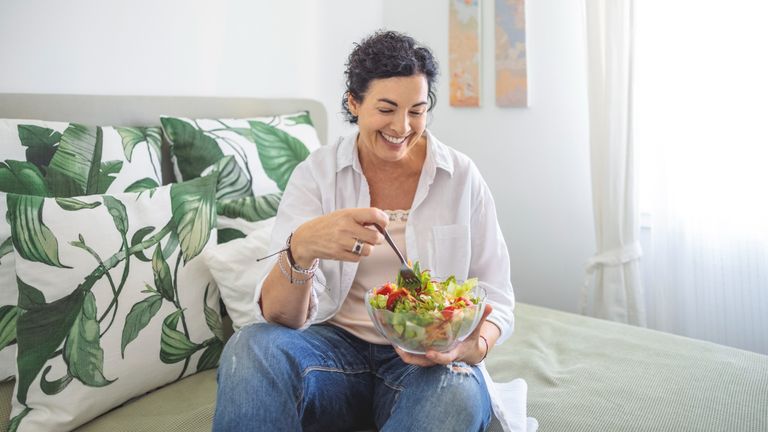 Woman about to tuck into a salad