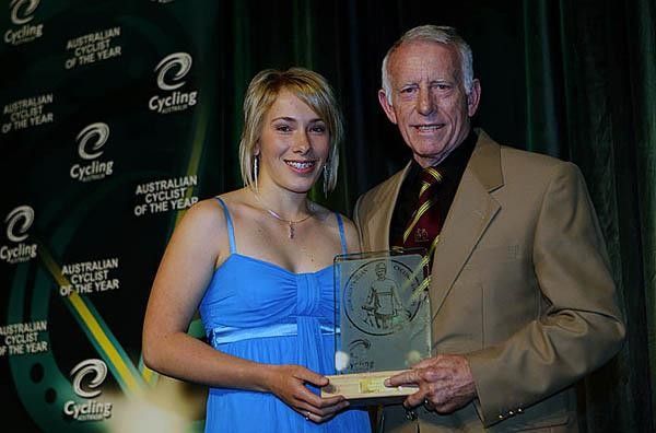 Caroline Buchanan presents Keith Oliver with his masters cyclist of the year award.