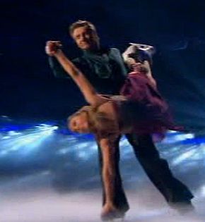Torvill and Dean skated round her as she sang the powerful ballad