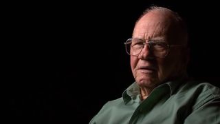 The real J.B. Stokes in front of a black backdrop