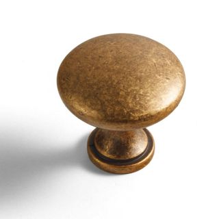 An antique brass knob