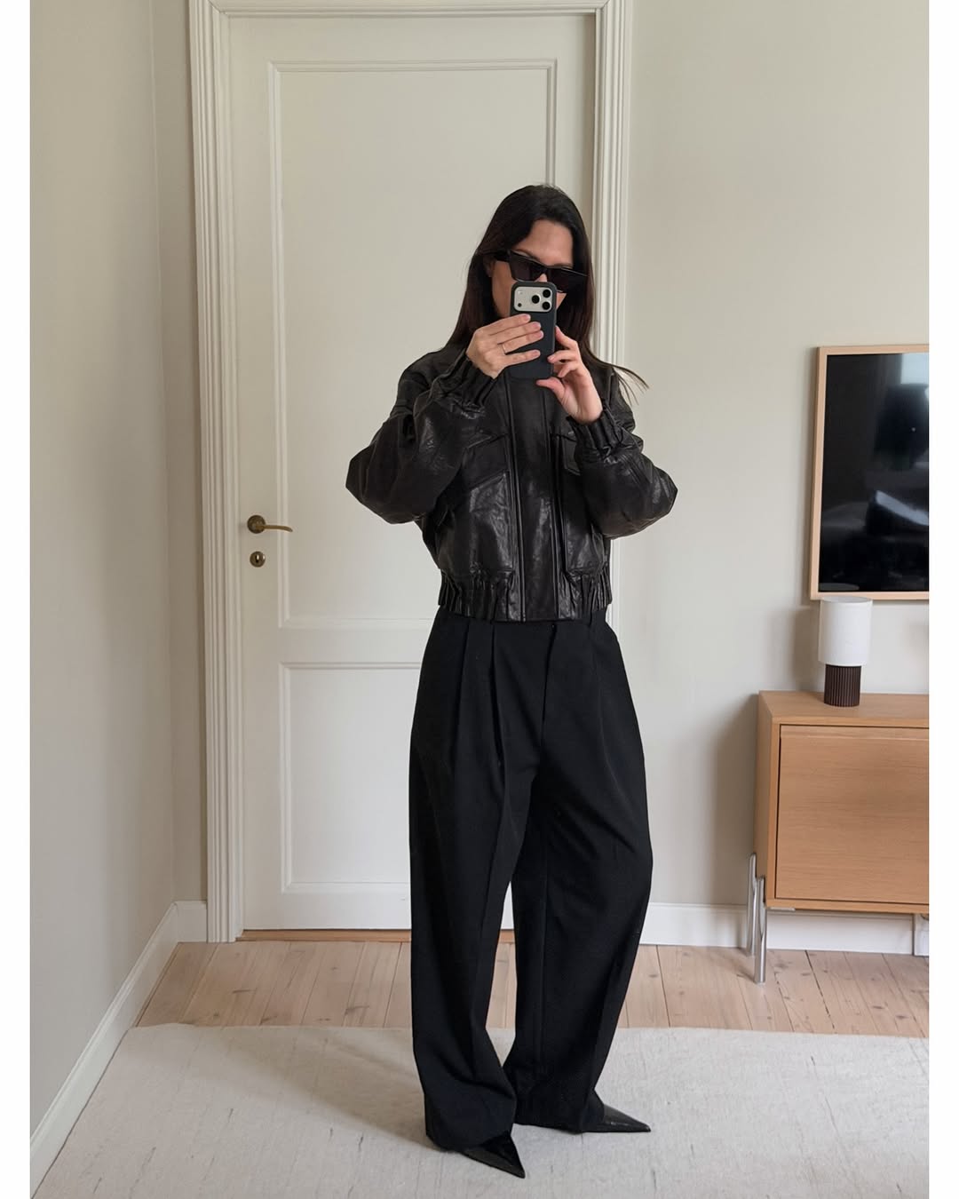 Woman wearing popular anti trend wardrobe items 2026.