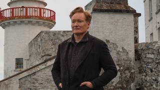 Conan O'Brien with hands in pockets for Conan O'Brien must go