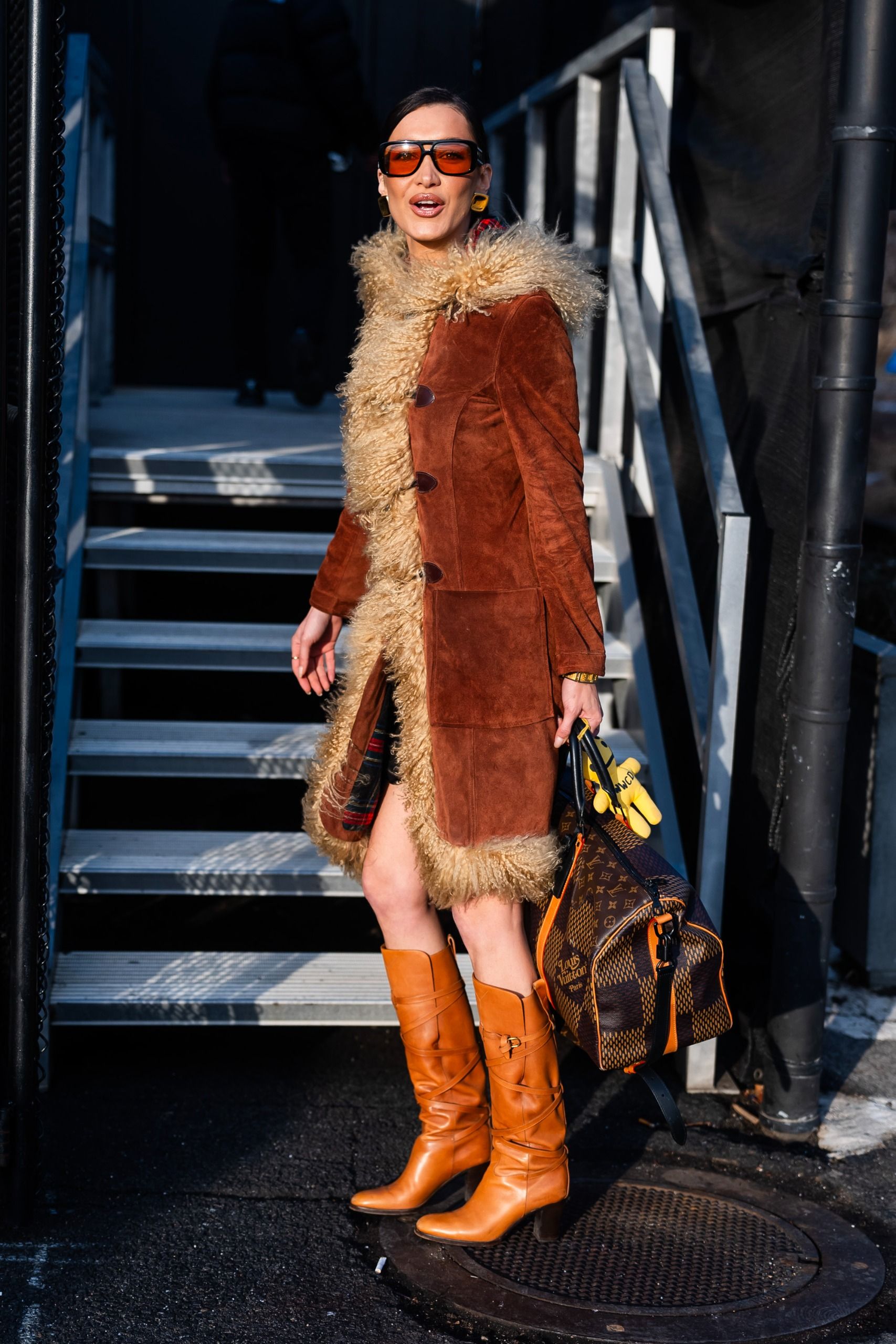Penny Lane coat trend 2026: Story image. Bella wears the Penny Lane Coat trend. These images were taken from Getty.