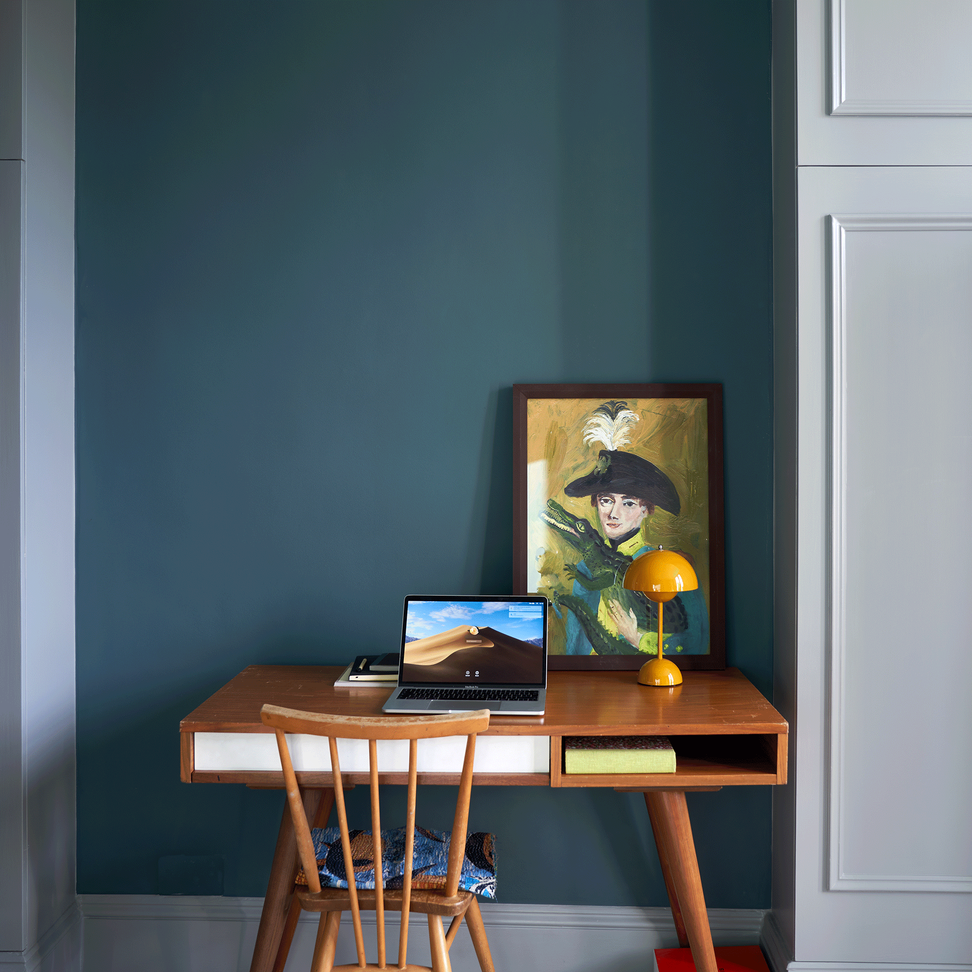 Inchyra Blue on walls with a wooden midcentury desk