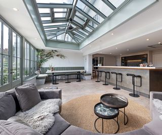 conservatory with sage green rooflight, windows and home bar area