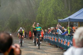 Eddie Willis celebrates grasping victory on top of Tawonga Gap in the opening stage of the Tour of Bright, 2023