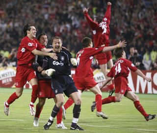 Liverpool players celebrate victory on penalties against AC Milan in the 2005 Champions League final.