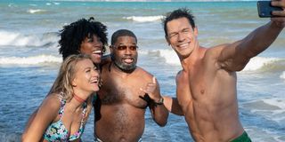 Meredith Hagner, Yvonne Orji, Lil' Rel Howery, and John Cena pose for a selfie on the beach in Vacation Friends.