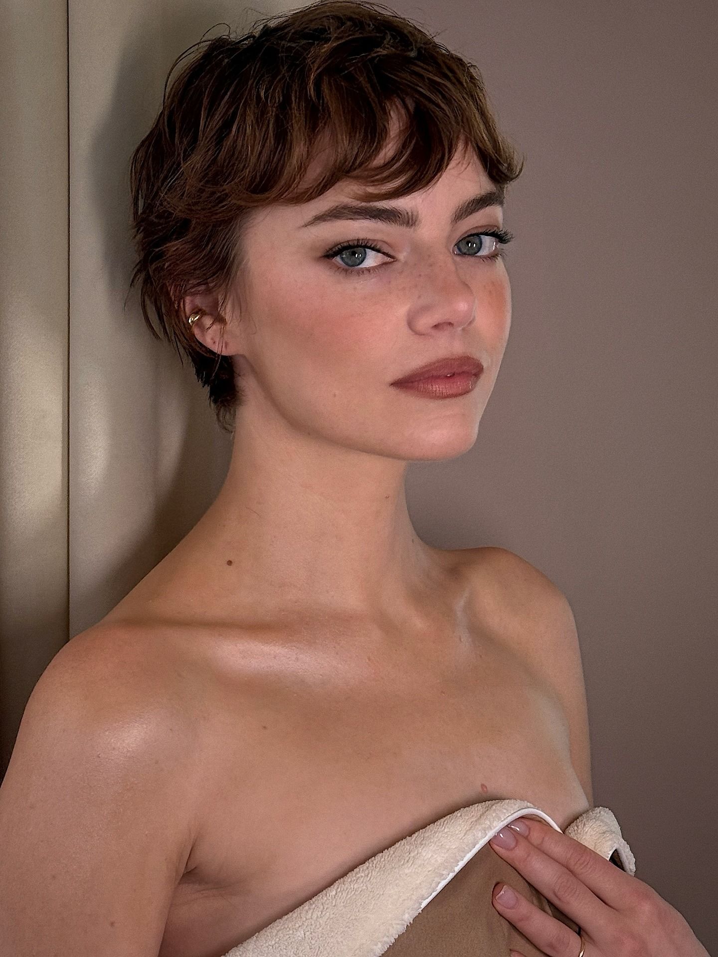 Emma Stone with a muted red pixie haircut