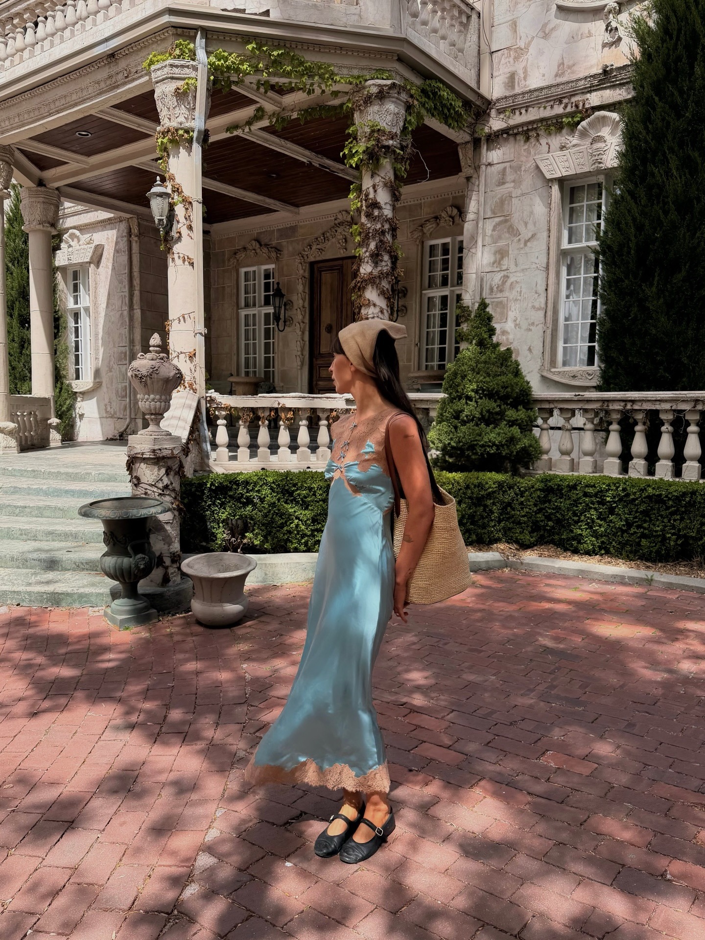 Woman in blue satin lace-trim dress