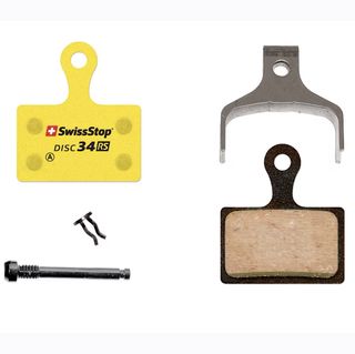 SwissStop 34 RS disc brake pads with pin, spring and in their signature yellow backing colour