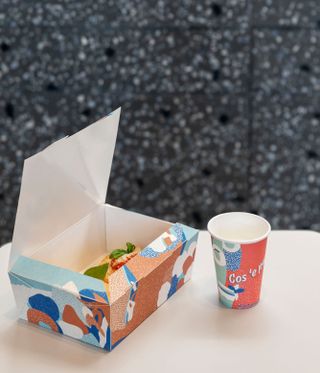 Antonino street food packaging with take-away food and an empty disposable cup