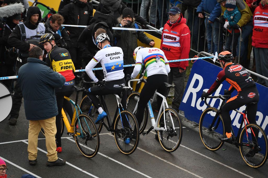 Wout van Aert and Mathieu van der Poel wait for the start line