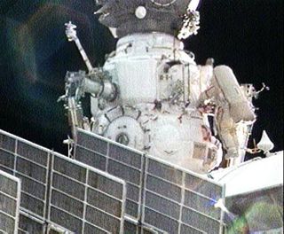 Spacewalkers Add New Experiments to Space Station