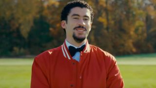 Oscar Mej&iacute;as (Bad Bunny) smiles in Happy Gilmore 2.
