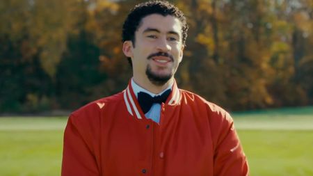 Oscar Mej&iacute;as (Bad Bunny) smiles in Happy Gilmore 2.