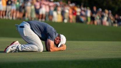 Masters champion Rory McIlroy of Northern Ireland celebrates on the No. 18 green after winning the Masters at Augusta National Golf Club, Sunday, April 13, 2025.