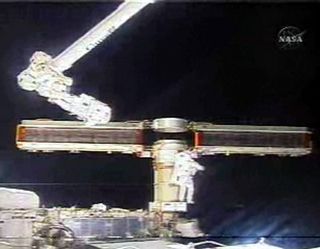 Atlantis Astronauts Fix Shuttle Blanket, Furl Solar Array
