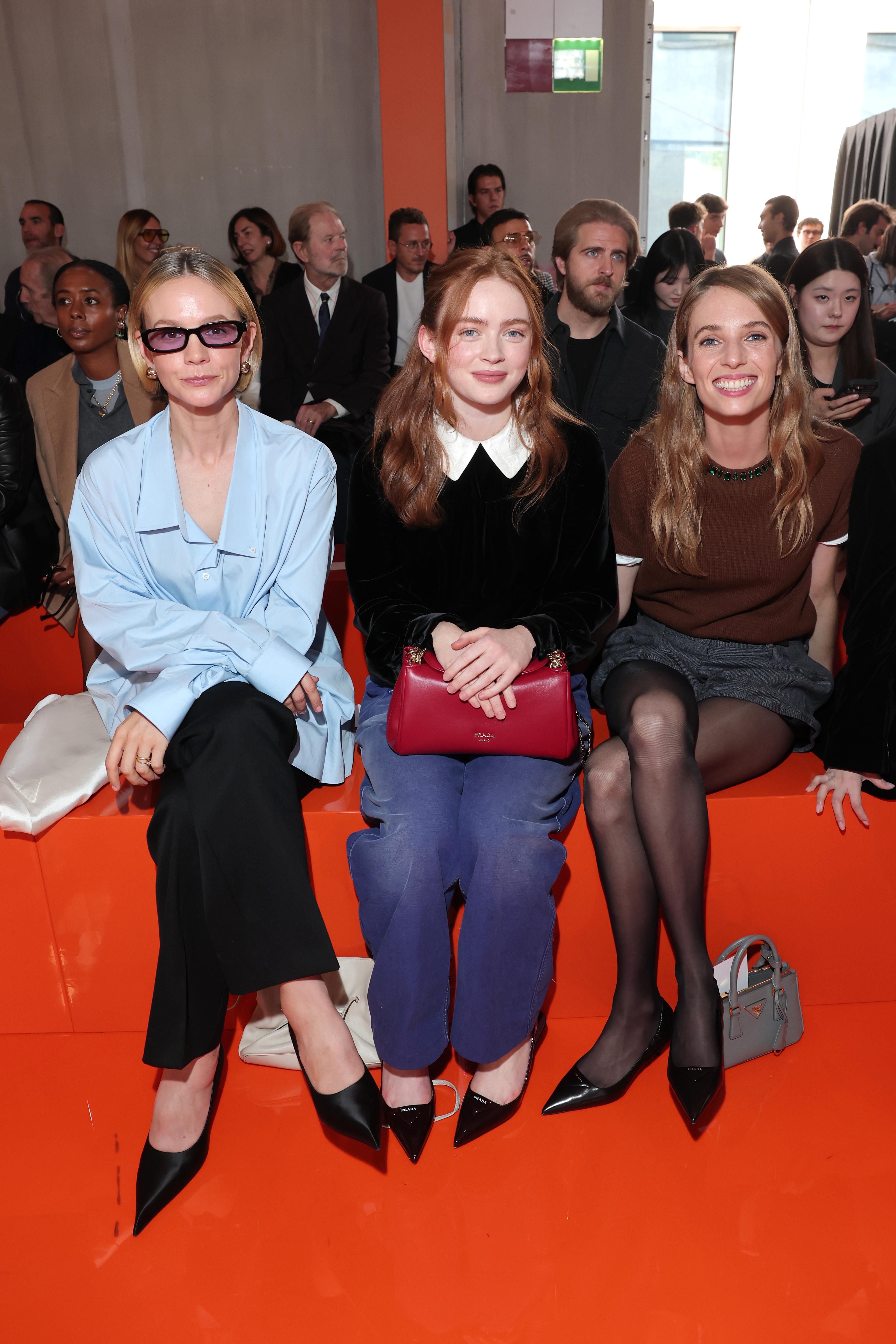 Maya Hawke, Carye Mulligan, and Sadie Sink in the front row at Prada
