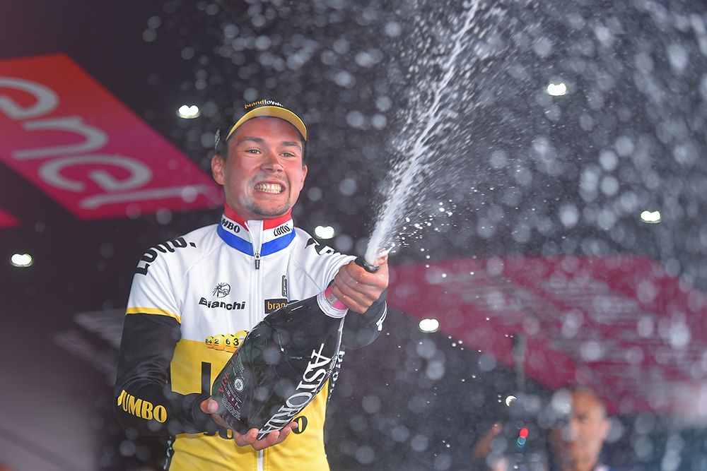 Primoz Roglic sprays the champagne
