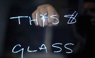 text thiss glass and a fist behind