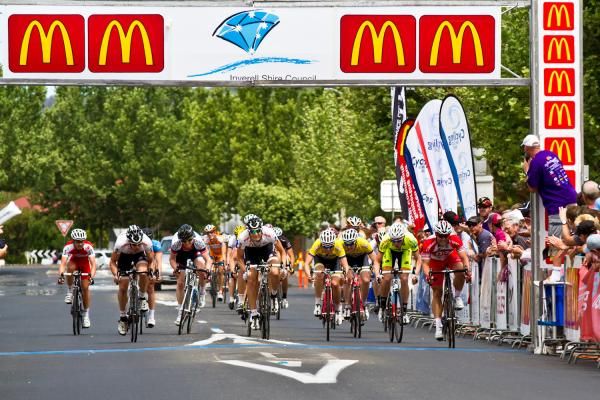 The other riders sprint to the line