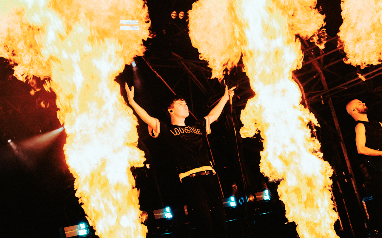 Knocked Loose on stage surrounded by fire