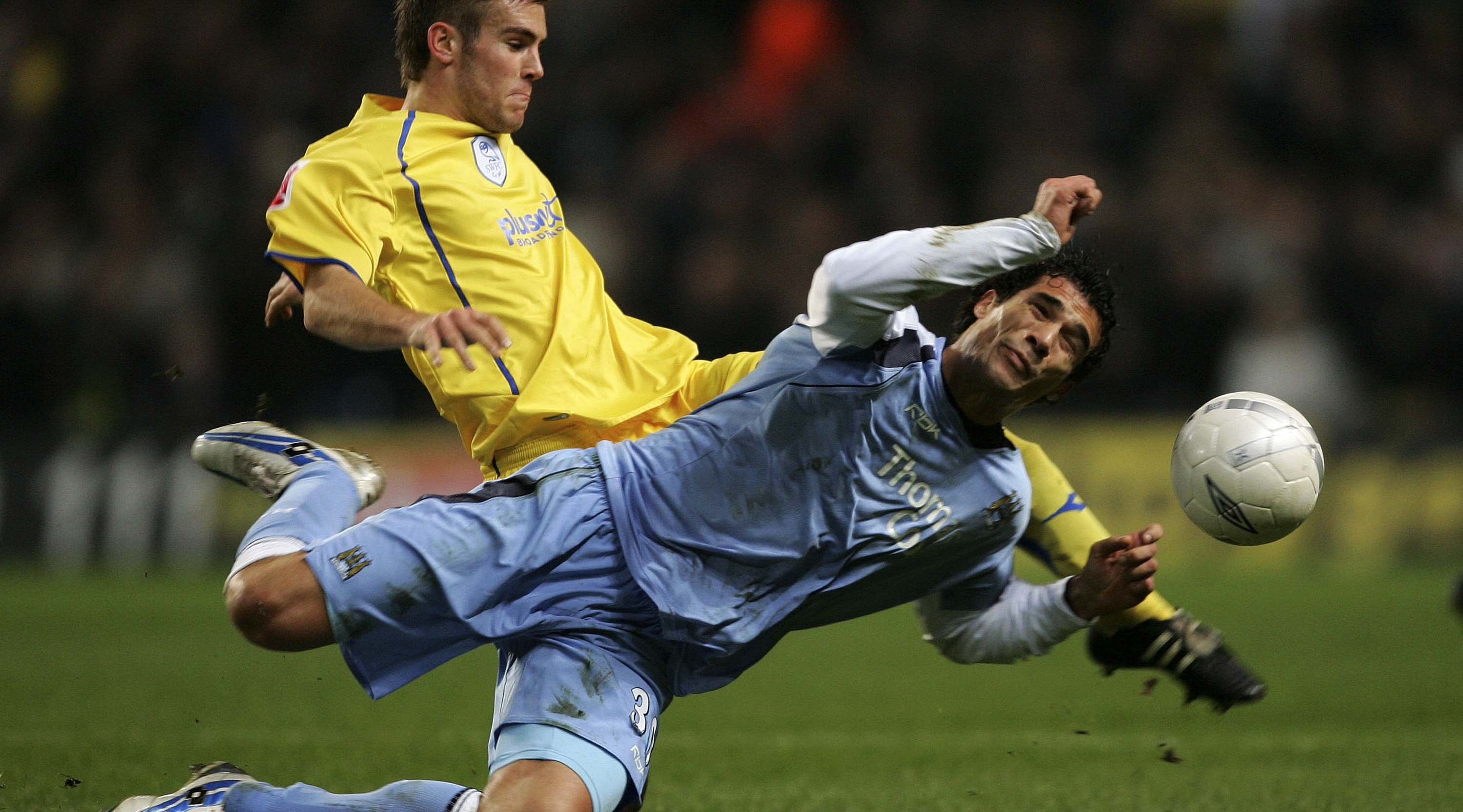 MANCHESTER, UNITED KINGDOM - JANUARY 16; Bernardo Corradi of Manchester City and Tommy Spurr of Sheffield Wednesday in action during the FA Cup sponsored by E.ON Third Round Replay match between Manchester City and Sheffield Wednesday at the City of Manchester Stadium on January 16, 2007 in Manchester, England. (Photo bGary Prior/Getty Images)