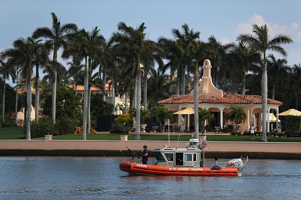 A Coast Guard boat drifts off Mar-a-Lago.