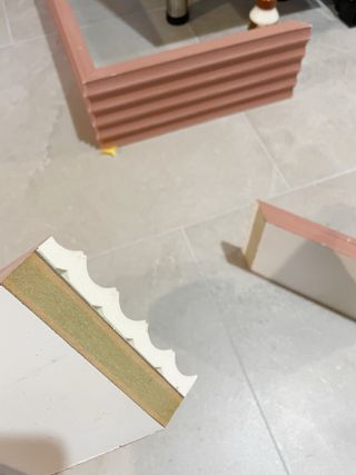 A piece of beadboard in the process of being painted