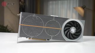 A screenshot of a video by YouTube channel chaowanke, showing a Lisuan LX 7G100 graphics card resting on a desk