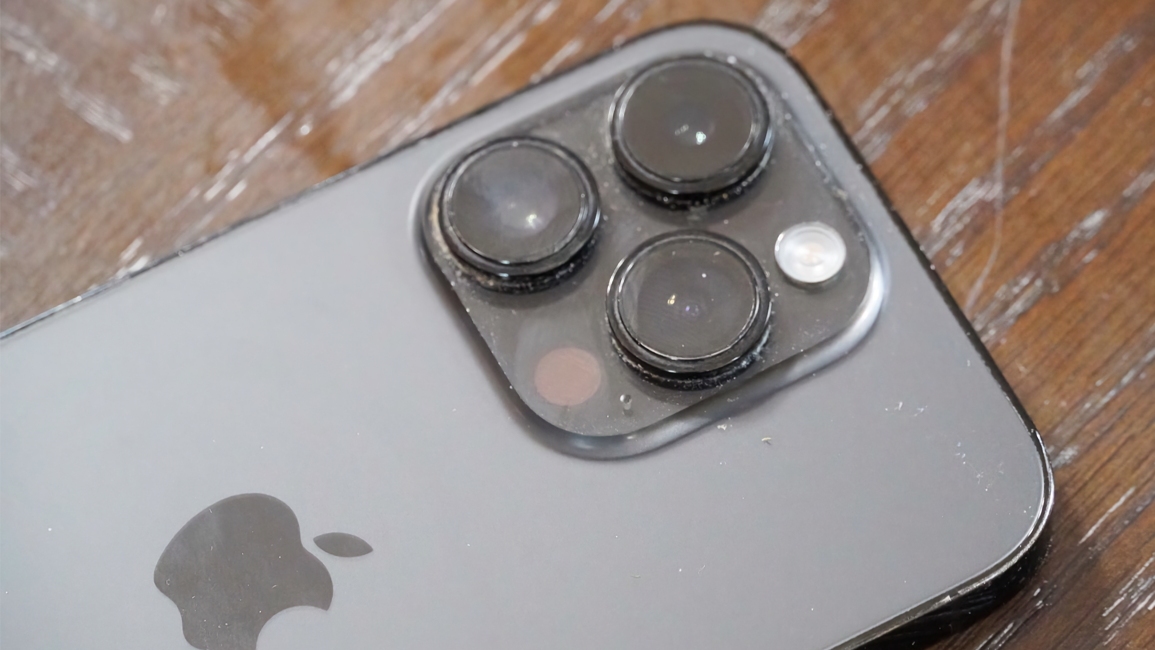 The camera bump of my dad's iPhone 14 Pro before using the Otterbox Mobile Device Care Kit.