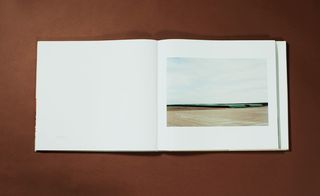 A single page photo featuring a barren landscape with pipes.