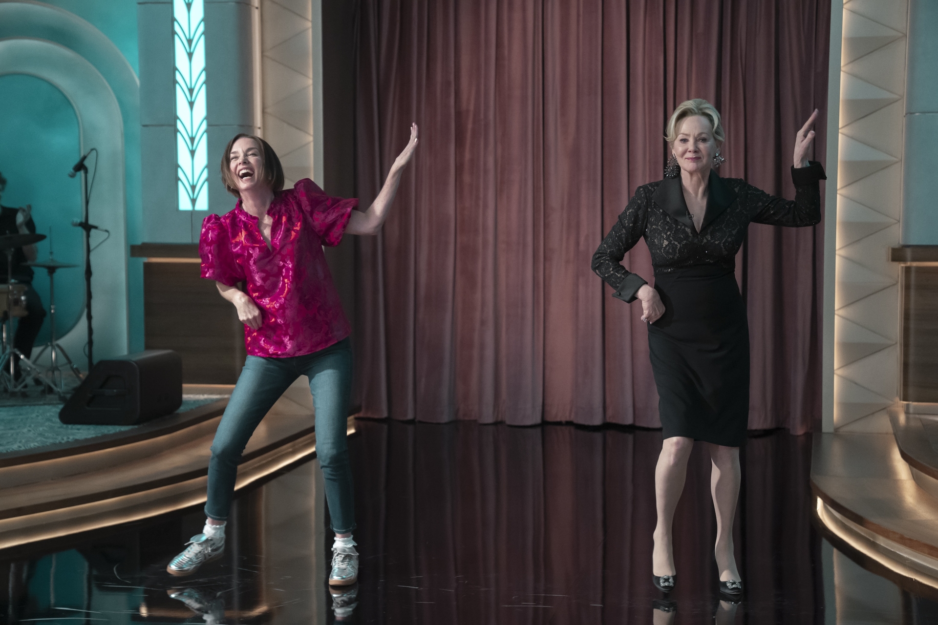 Dance Mom (Julianne Nicholson) and Deborah Vance (Jean Smart) dance on a late night stage, in 'Hacks' season 4.