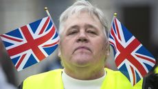 A pro-Brexit construction worker sporting Union Jack flags